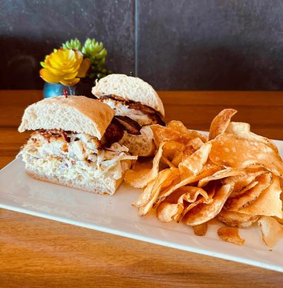 Grouper sandwich with ranch slaw and French fried potato slices at 5350 The Pourhouse